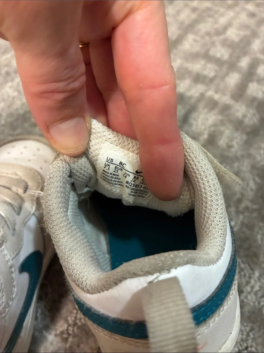 Nike Kids White Sneakers with Teal Swoosh and Orange Logo